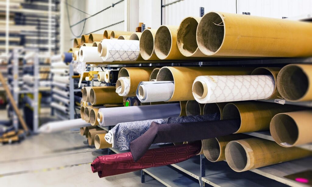 pexels-photo-236748-236748-1 Rows of textile rolls stored in a factory for industrial manufacturing.
